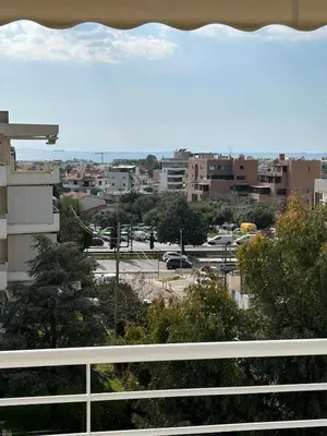 a view of a city from a balcony at Glyfada Top-Floor 2BR, Sea and City Views in Athens