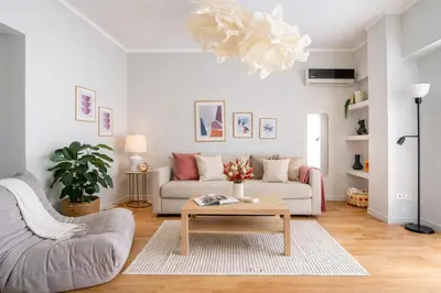 a living room with a couch and a coffee table at Urban Grace - In the Heart of Athens in Athens