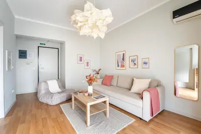 a living room with a couch and a table at Urban Grace - In the Heart of Athens in Athens