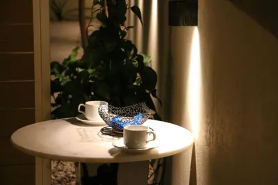 a table with two coffee cups on top of it at FaliroRelax F1 in Athens