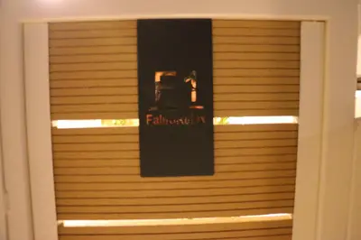 a window with a sign that reads featheasternheasternheasternheastern at FaliroRelax F1 in Athens