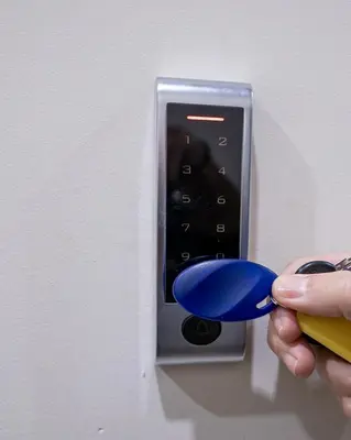 a person is holding a blue object in a lightswitch at Tettix Athens Appartment B1 in Athens
