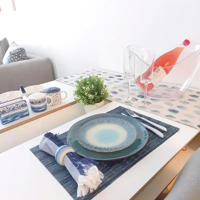 a table with a plate on top of a table at Noeli Apartment by ΜΡS in Athens