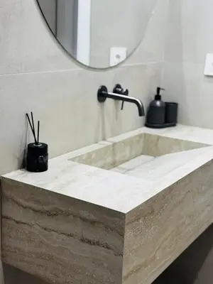a bathroom with a sink and a mirror at Glyfada Unique Luxury & Spacious Apartment in Athens