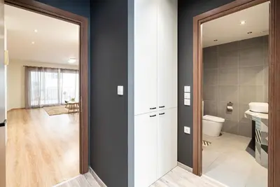 a bathroom with a toilet and a sink and a mirror at Athens Dimora Di Aristotele 2 in Athens