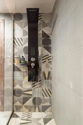 a bathroom with a shower with a phone on the wall at Athens Dimora Di Aristotele 2 in Athens