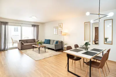 a living room with a table and a couch at Athens Dimora Di Aristotele 3 in Athens
