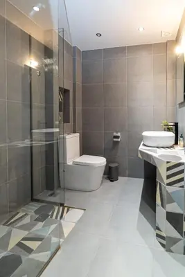a bathroom with a toilet and a sink and a shower at Athens Dimora Di Aristotele 3 in Athens