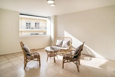 a room with chairs and a table and a window at Athens Dimora Di Aristotele 3 in Athens