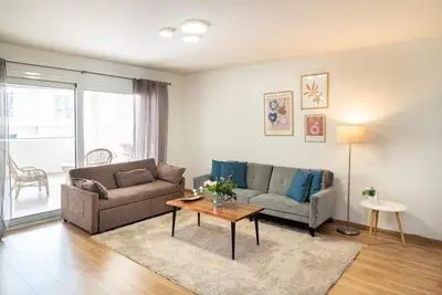 a living room with a couch and a table at Athens Dimora Di Aristotele 3 in Athens