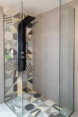a shower with a glass door in a bathroom at Athens Dimora Di Aristotele 3 in Athens