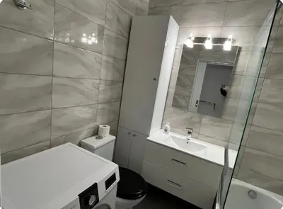 a bathroom with a sink toilet and a mirror at A warm home near the center 2 in Athens