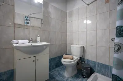 a bathroom with a toilet and a sink at Kastella Sea Breeze Studio by ΜΡS in Piraeus