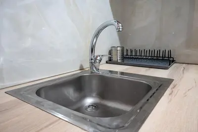a kitchen sink with a faucet on a counter at Authentic Athens Living In Zografou by ΜΡS in Athens