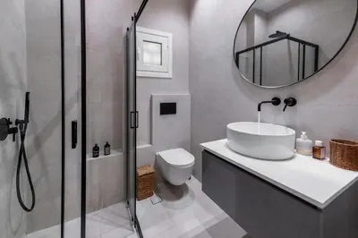 a bathroom with a sink and a toilet and a mirror at Acropolis Boutique Retreat in Koukaki Area Athens in Athens