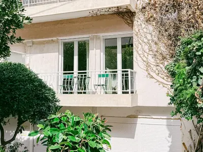 a balcony of a house with chairs on it at Spacious 2BR house in Nea Smyrni in Athens