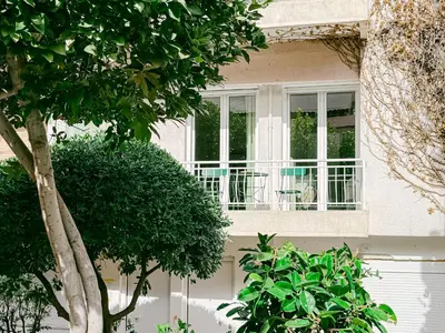 a window of a house with a table and chairs at Spacious 2BR house in Nea Smyrni in Athens