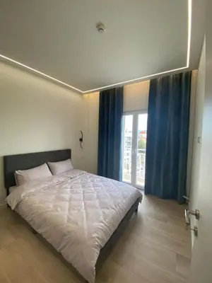 a bedroom with a large bed and a window at Sky5 Apartment in Athens