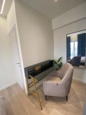 a living room with a piano and a chair at Sky5 Apartment in Athens