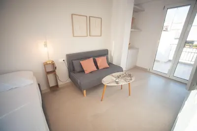 a living room with a couch and a table at Zeno Apartments Athens in Athens