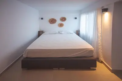 a bedroom with a large bed in a room at Zeno Apartments Athens in Athens
