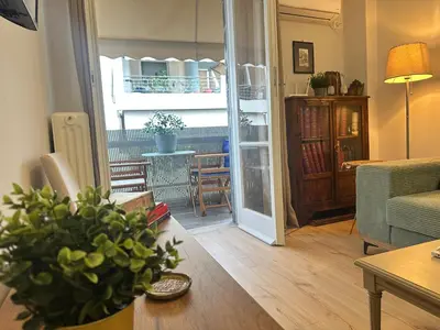 a living room with a couch and a table at Upper Kypseli Nest Apartment in Athens