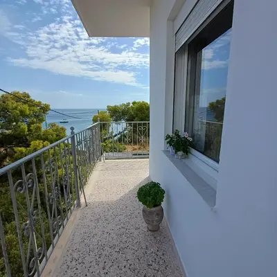 a balcony with a view of the ocean at Kalimera Aegina in Agia Marina Aegina