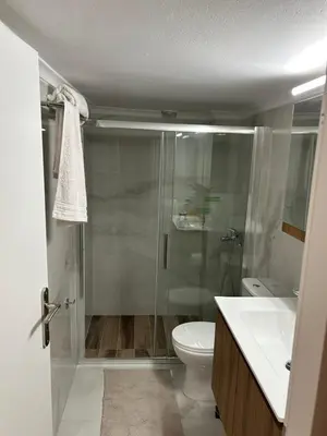 a bathroom with a shower and a toilet and a sink at Star Modern Apartment Kipseli in Athens