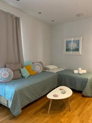 a living room with a couch and a table at Ermou 44 - 2bdr apartment in Athens