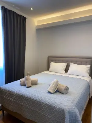 a bedroom with a bed with towels on it at Ermou 44 - 2bdr apartment in Athens