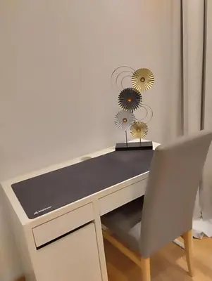 a white desk with a chair and flowers on it at Ermou 44 - 2bdr apartment in Athens