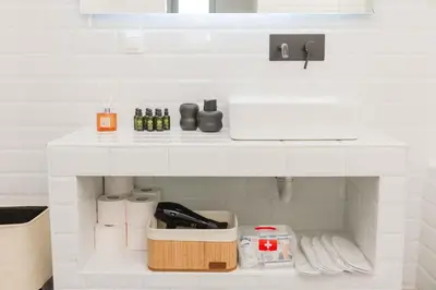 a kitchen with a white counter top with a shelf at Artistic Luxury with Acropolis View in Psirri Monastiraki in Athens