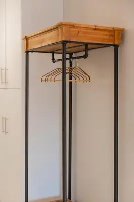 a table with black legs and a wooden top at Artistic Luxury with Acropolis View in Psirri Monastiraki in Athens