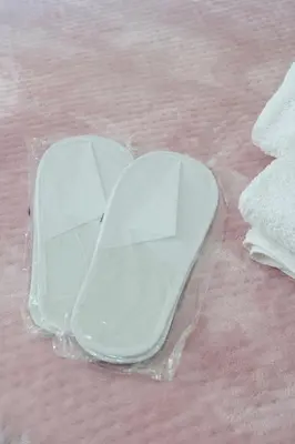 a plastic tray sitting on top of a pink bed at Beautiful apartment under Acropolis in Athens