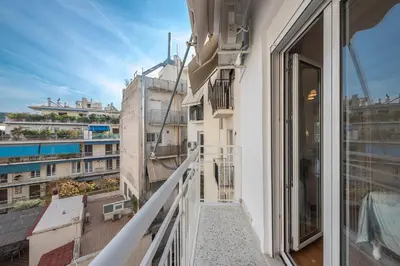 a balcony with a view of a building at Sun-Kissed Koukaki Apartment City Views in Athens
