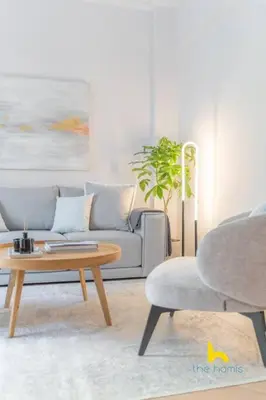 a living room with a couch and a table and a chair at Spacious 3BR Retreat w 2 Baths & Fast Wi-Fi in Athens