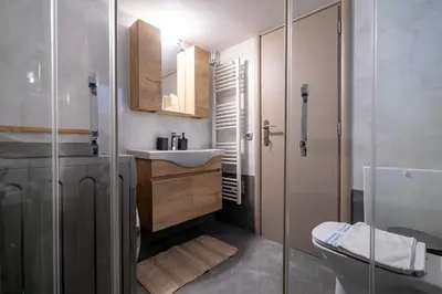 a bathroom with a shower and a sink and a toilet at Central Nea Smyrni 2BR Apt-Near Transport by ΜΡS in Athens