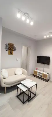 a living room with a couch and a tv at Dream House Egaleo in Athens