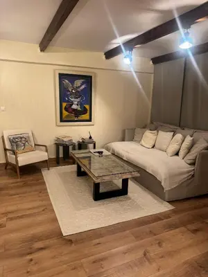 a living room with a couch and a coffee table at home 4 in Athens