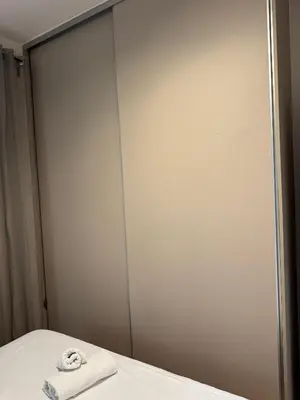 a bathroom with a mirror and a towel on a bed at home 4 in Athens