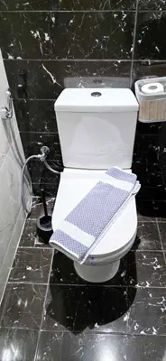 a bathroom with a toilet with a towel on it at Kalisti House2Heal Athens in Athens
