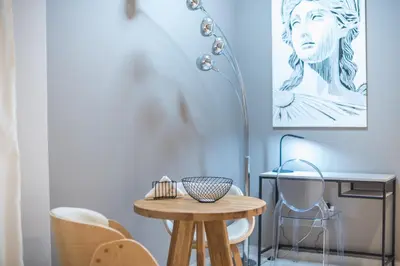 a table in a room with a desk and chairs at Acropolis View Dream Stay nr 5 in Athens