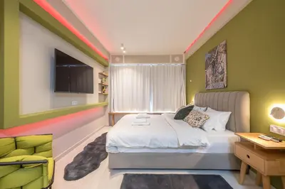 a bedroom with a bed and a desk and a television at Acropolis View Dream Stay nr 5 in Athens