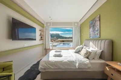 a bedroom with a bed and a large window at Acropolis View Dream Stay nr 5 in Athens