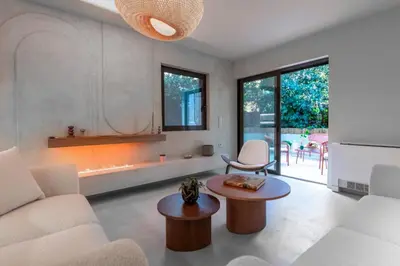 a living room with a couch and a table at Modern Αpartment 12 in the center of Glyfada in Athens