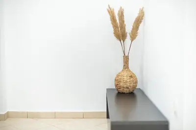 a vase sitting on a table next to a wall at Athenian home near Acropolis in Athens