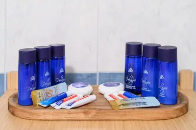 a wooden tray with toothbrushes and toothpaste at Glyfada Cove Apartments-Ostria in Athens