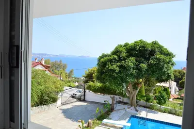 a view of a swimming pool from a window at Art Blue Residence-Apartment Athens in Aghia Marina