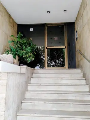 a set of stairs in front of a building at Minimalistic luxury apartment in Acropolis in Athens