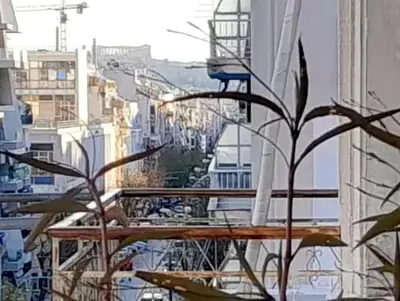 a view of a city from the balcony of a building at Victoria Flat in Athens